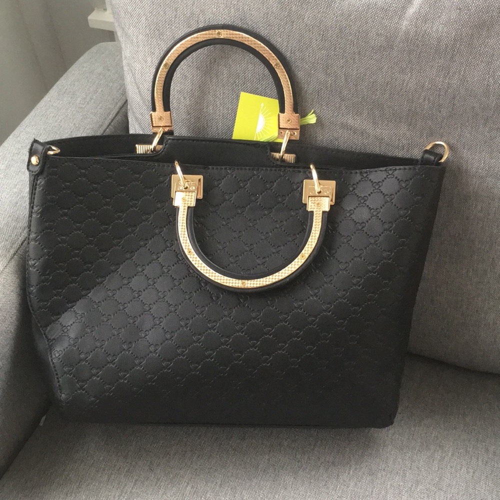 Cute black purse with gold hardware.